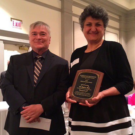 Shirley Hendrick Award recipient Daad Rizk with Penn State President Eric Baron